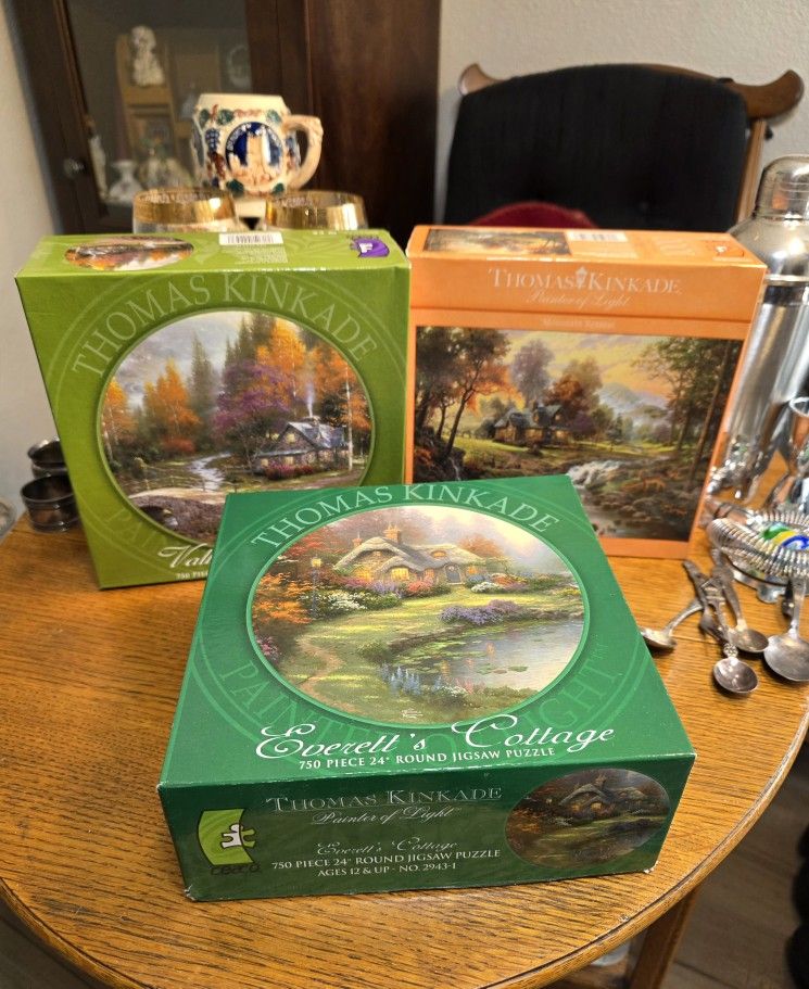 Three Thomas Kinkade Puzzles
