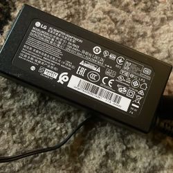   The LG AC adapter, model number DA-38A25, which has an output of 25V 1.52A,