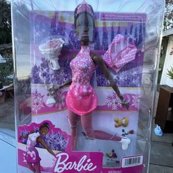 Barbie Winter Sports Ice Skater Brunette Doll (12 Inches) with Pink Dress, Jacket, Rose Bouquet & Trophy