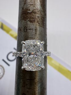 4.01 carat E VS1 cushion lab diamond with a pave band and hidden halo engagement ring