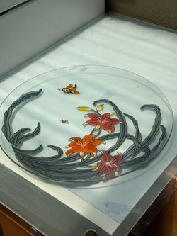 Beautiful 13” glass plate with an elegant floral design. A lovely piece for serving or adding charm to your home décor