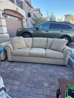 Beige corduroy sofa and matching oversized chair