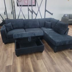 New 2pc Sectional And Storage Ottoman In Black Corduroy 