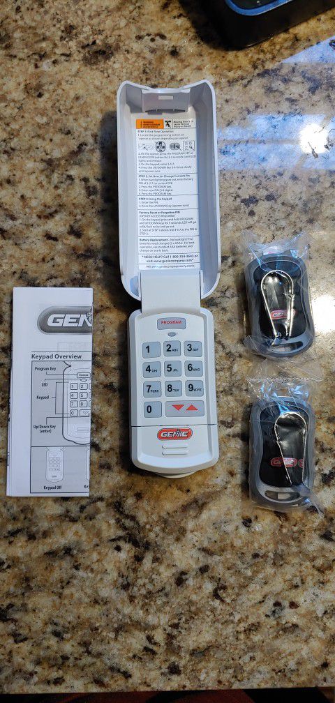 Two New Genie Garage Door Opener Remotes And One Wireless Keypad