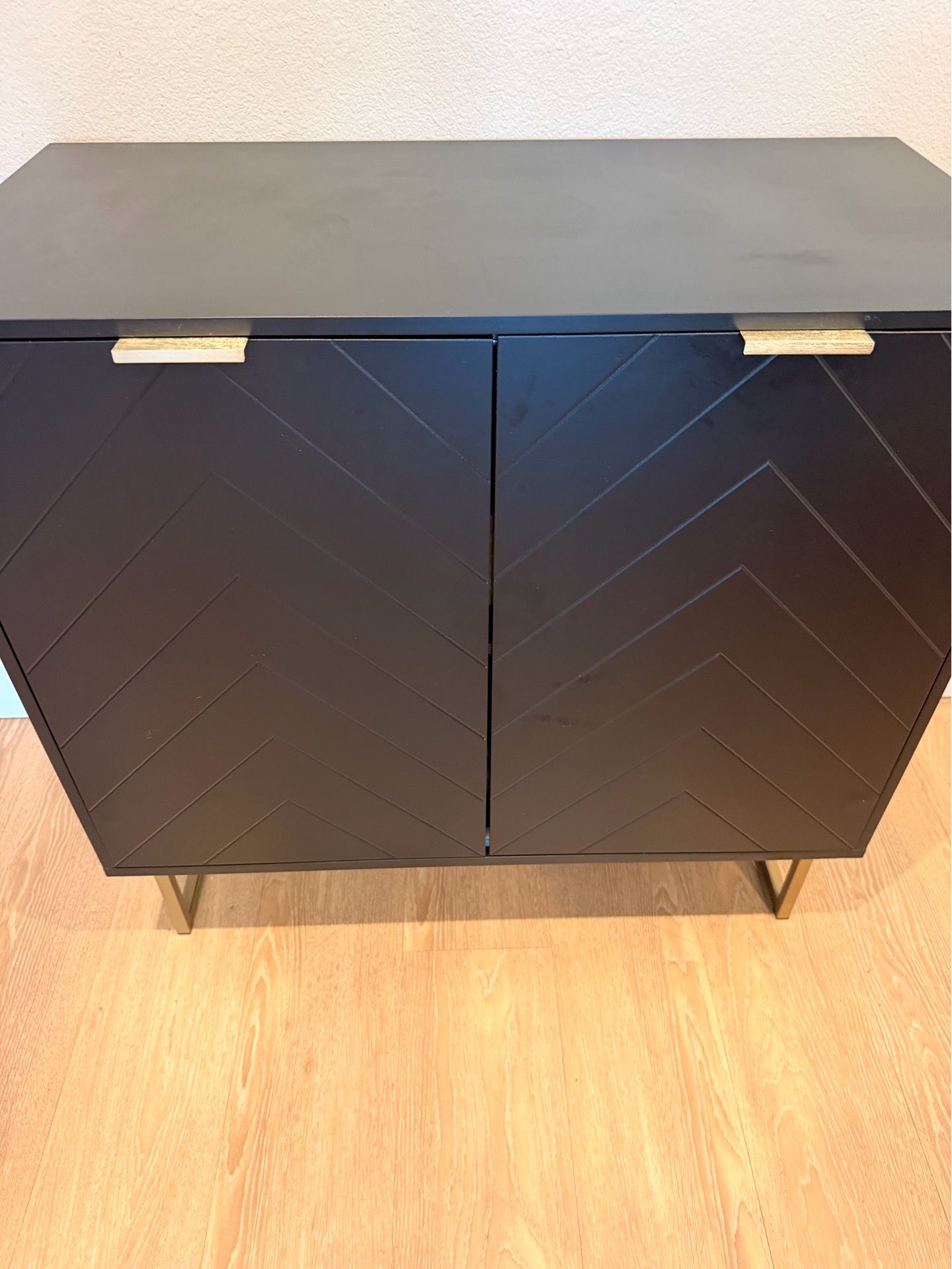 Black herringbone storage cabinet