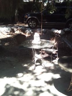 Glass table with metal chairs.