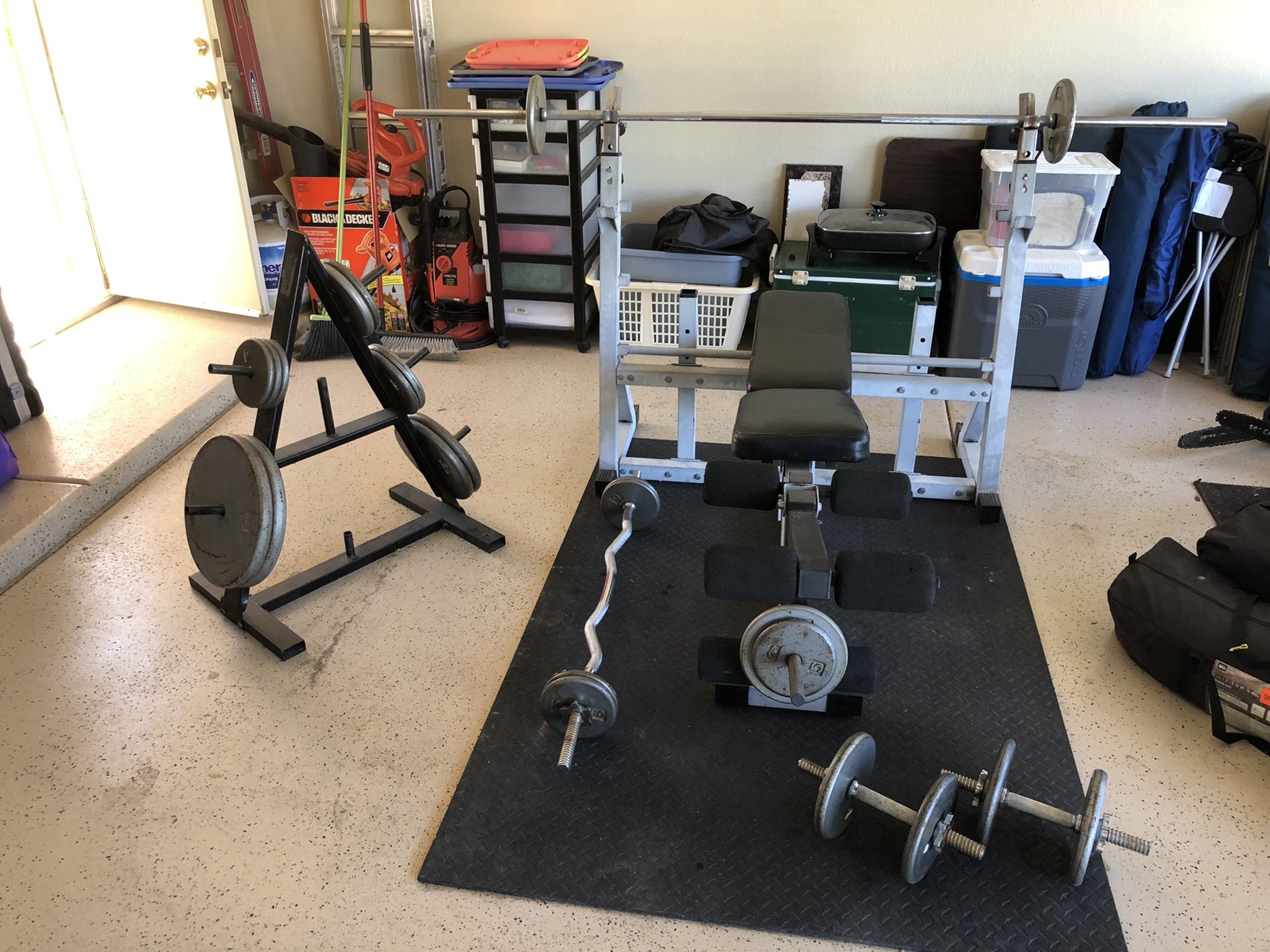 Weight set w bench, weight tree, mat and 300 lbs of weights