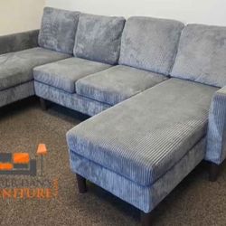 Brand new grey corduroy Sectional Sofa with chaise on each side.