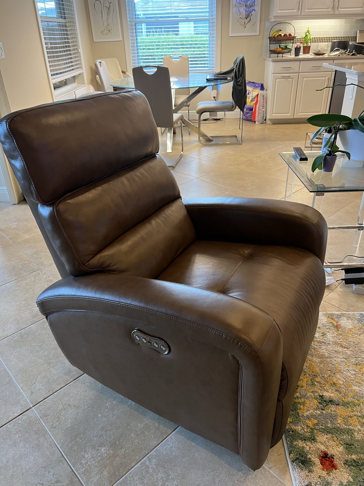 Brown leather dual power recliner armchair.