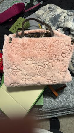 Lv bag pink faux-fur or velvet-textured tote bag featuring an embossed Louis Vuitton monogram pattern.