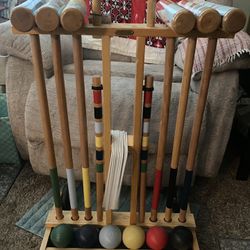 Wood croquet set, cart with wheels. no missing pieces only use a couple times, like new