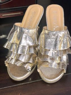 Beautiful NEW gold frilly heels. Size 7 but 6.5 can fit