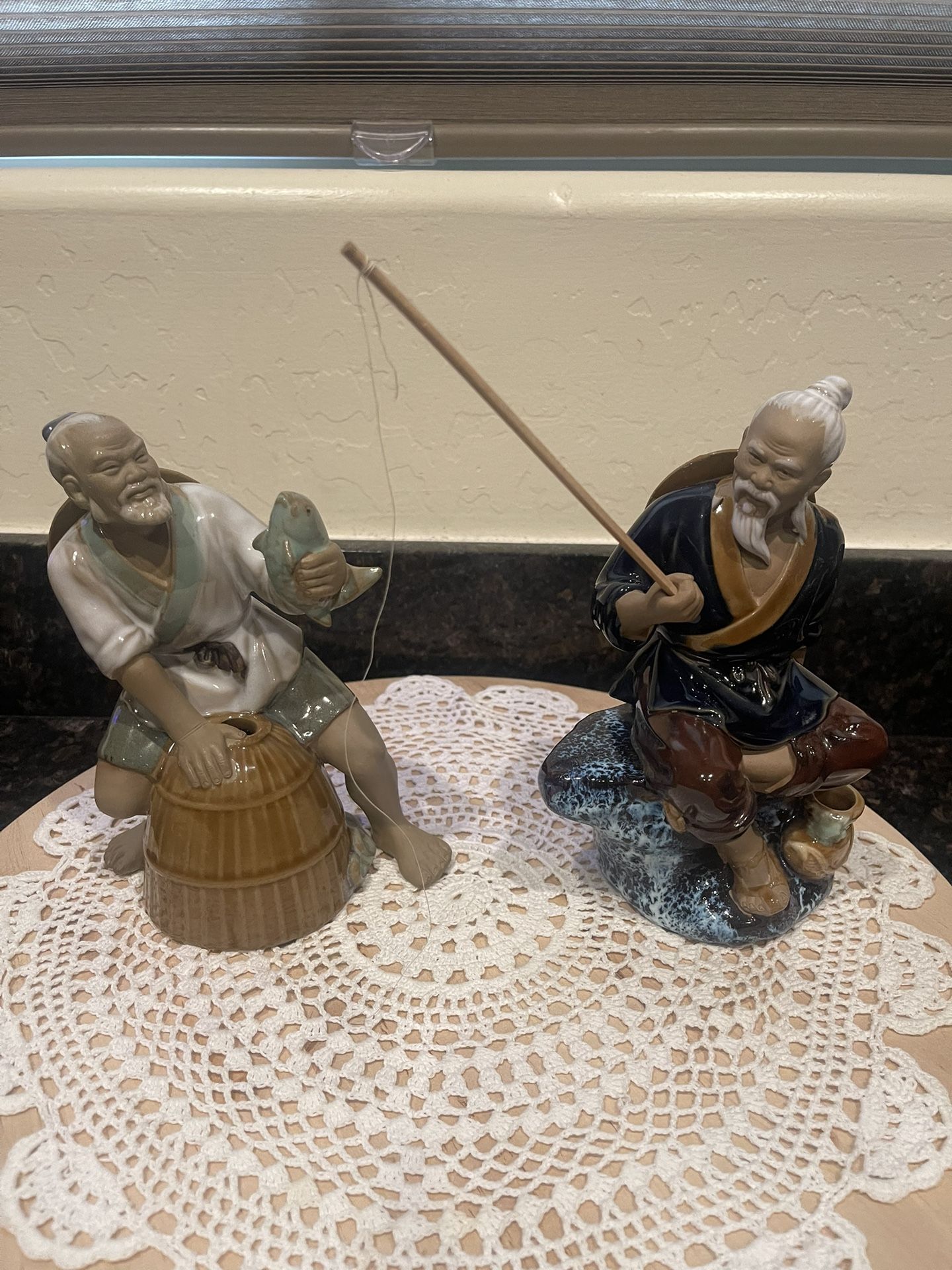 2 vintage porcelain fisherman