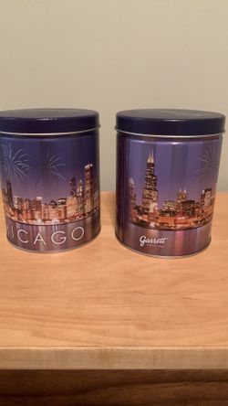 Two Collectible Chicago Skyline Garrett Popcorn tins, about 5” tall x 4” wide
