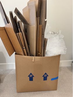14 moving boxes, packing paper, and bubble wrap