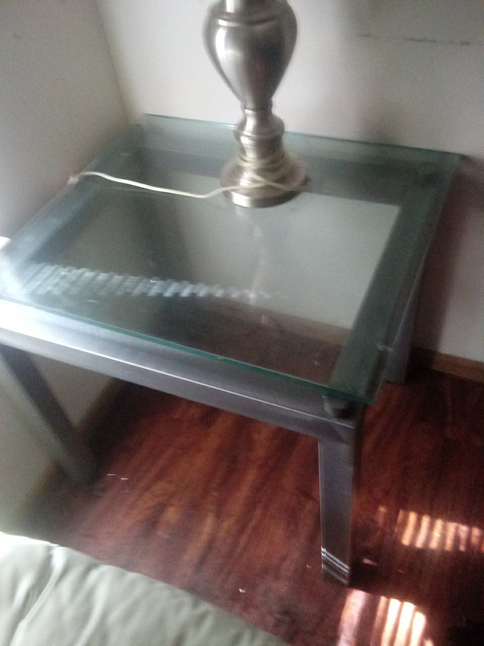 Dark Gray mental end Tables glass top lol yellow polish on top on 2nd end table remover will come off