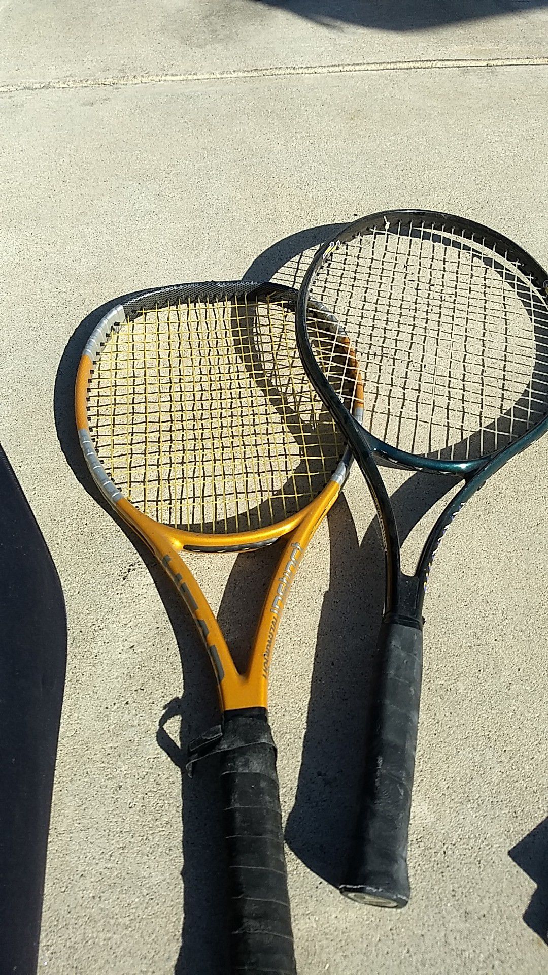 Two tennis rackets for sale with 15 tennis balls