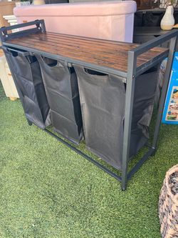 new three-compartment laundry basket