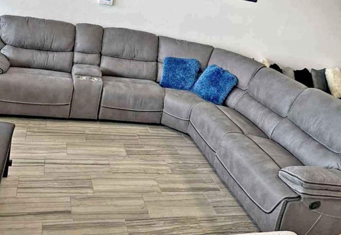 Alejandra Gray reclining sectional now only $1299. Easy finance option. Same-day delivery.