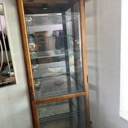 Howard Miller Oak Curio Cabinet