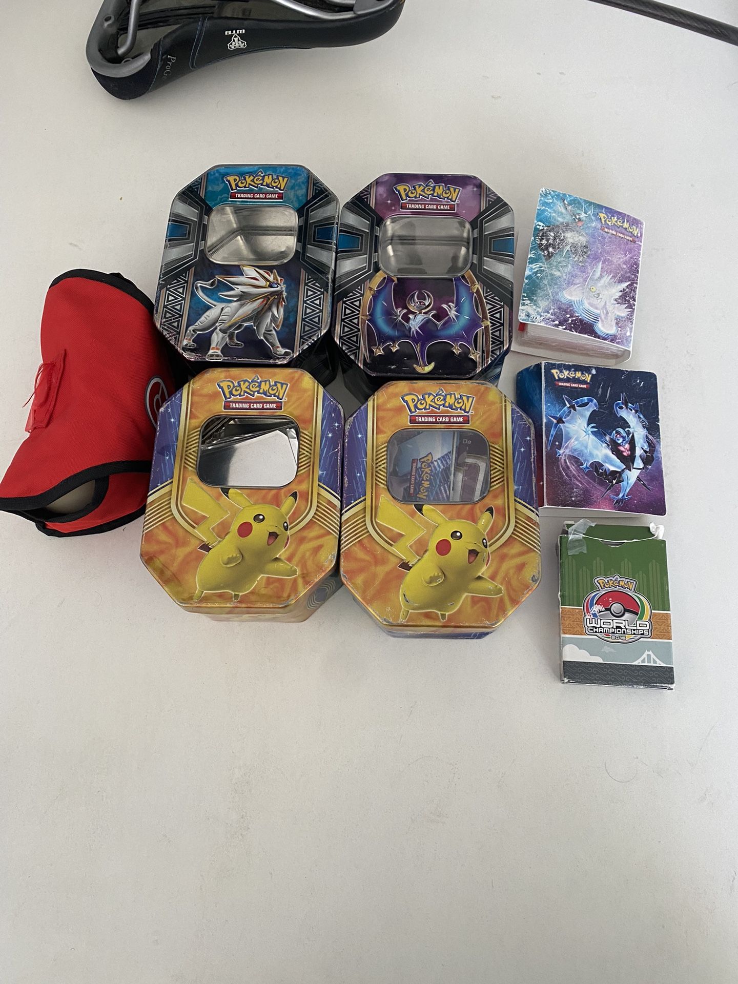 Empty Pokemon Tins, Pokémon mini binders, etc.