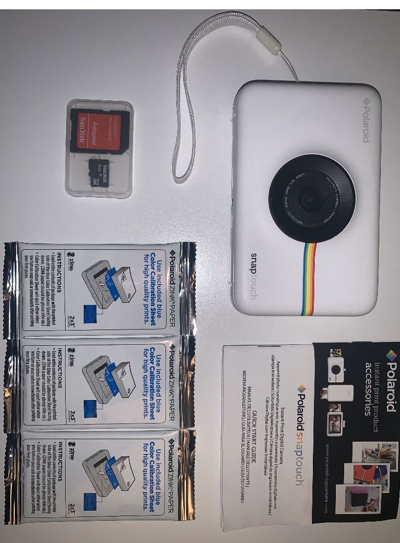 Polaroid Snaptouch camera with accessories