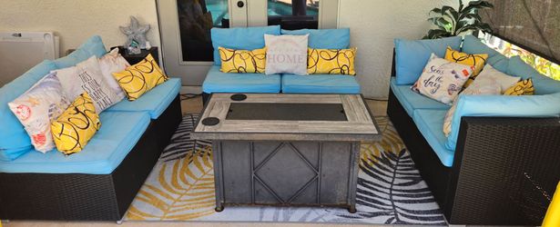 Three piece wicker patio set with cushions
