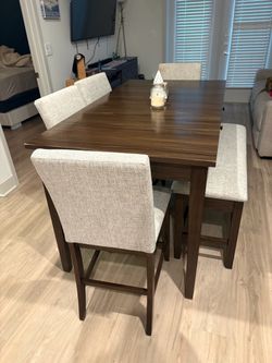 6 seater dining table with bench and storage