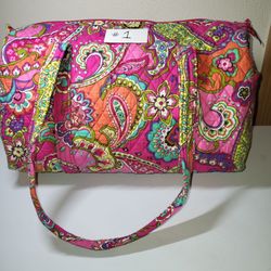 Vera bradley duffle bag 18" wide 10" tall.  Barrel shape