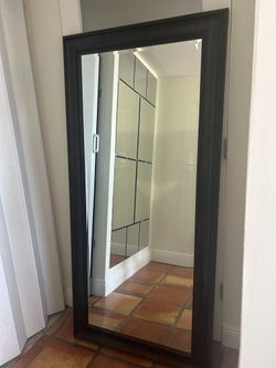 Brown mirror: Modern wall mirror in excellent condition.