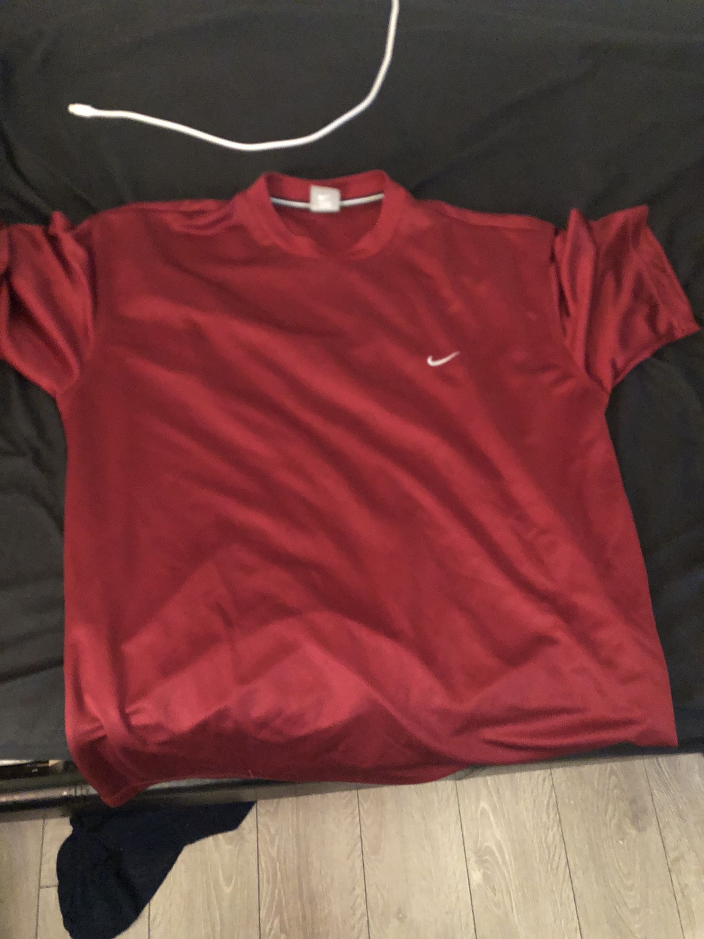 Nike SIZE XL BUT CAN FIT LARGE burgundy jersey type tee.