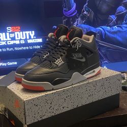 Black/red Jordan 4  retro bred 