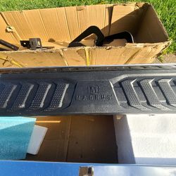 Step rail for a truck.
