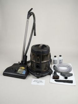 Rainbow E2 series canister vacuum cleaner with a water basin, power nozzle attachment, and var