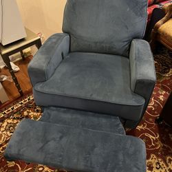 Blue spinning recliner chair