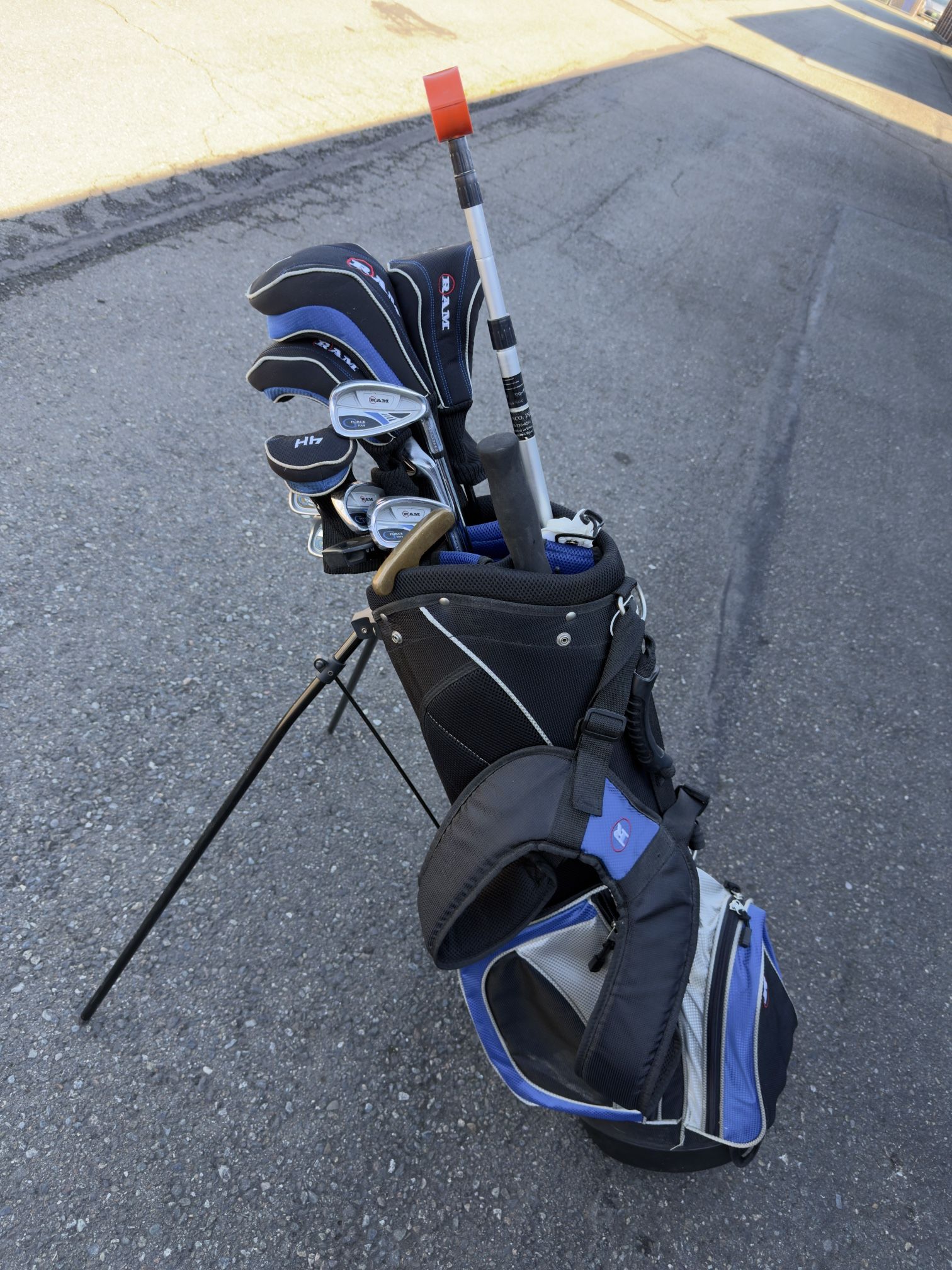 complete set of golf clubs in a stand bag