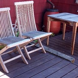 Small cedar patio table with 2 teak folding chairs