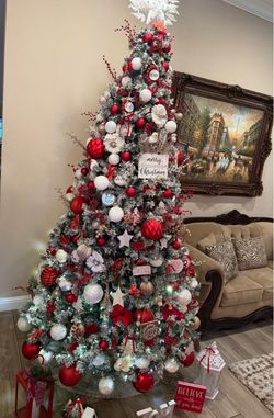9 Ft Flocked  Christmas tree with warm led lights wheel included and storage bag