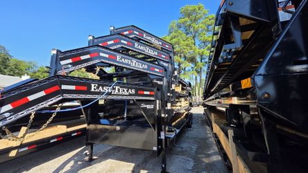 24ft and 28ft East Texas Lowboy trailers with Slide out Ramps!