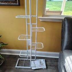 NEW IN BOX. I PUT IT TOGETHER,  7 TIERS, PLANT STAND. VERY NICE. SEE PHOTOS. CASH, PICKUP ONLY. 