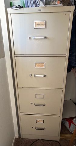 Metal File cabinet with 4 drawers.