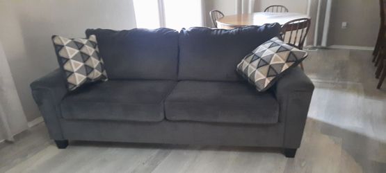 Gray couch, very comfey! Was in a house with cats. It does need cleaned. It has the common minor cat claw mark on the end corners.