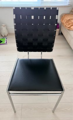 Black leather chair with metal legs