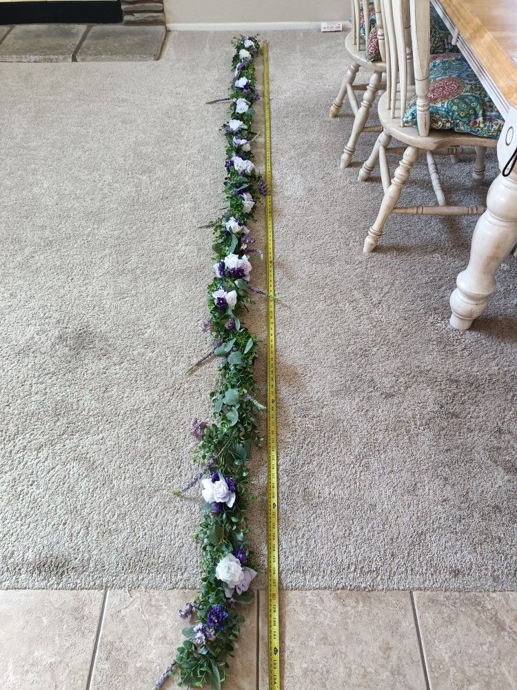 2 Artificial Flower Garland wreaths for table decorCondition is used twice$120 for longest wreath$110 for shorterMeasurement of each arrangement