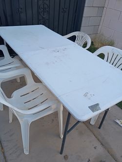 Table and Plastic Chairs