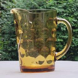 Vintage Hazel-Atlas Eldorado Amber Gold Pitcher. It is also known by other names such as "Coin Dot," "Capri Dot," "Raindrop," and "Thumbprint"