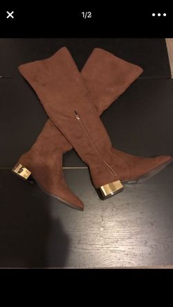 Brand new Suede knee high boots with gold heel. Size 7