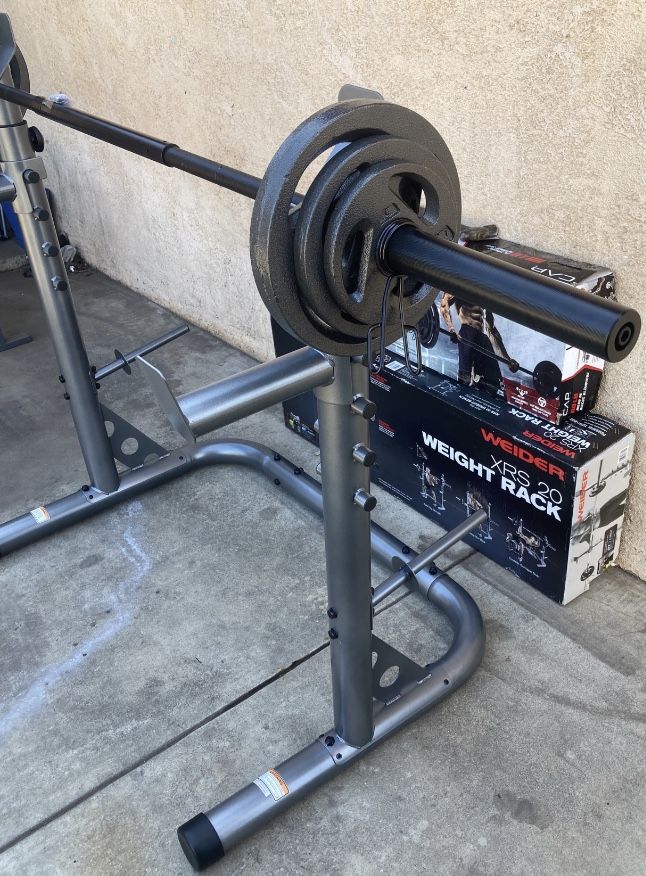 Weights XRS 20 Squat Rack With 110lb Olympic Set Comes With a 3 Piece 7ft Olympic Bar 2x25s,2x10s and 2x5s (built or in Box)