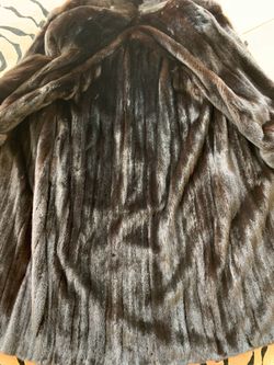 Gorgeous female mink coat with cuffs and perfect lining. No smoke or pets. Coat barely sworn and paid $9550. It is a large and is full length.
