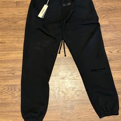Black essentials pants cuffed